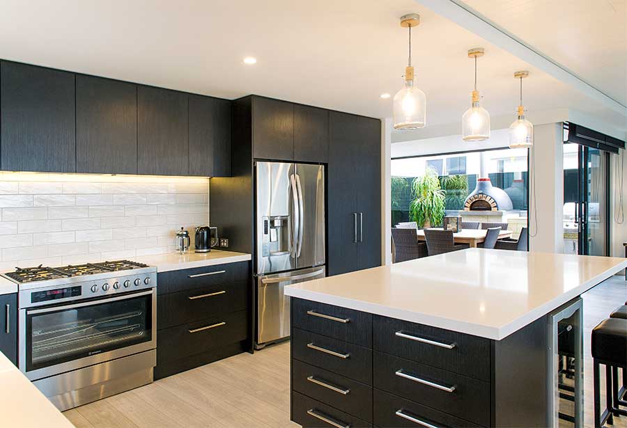 Black kitchen with white stone benchtops