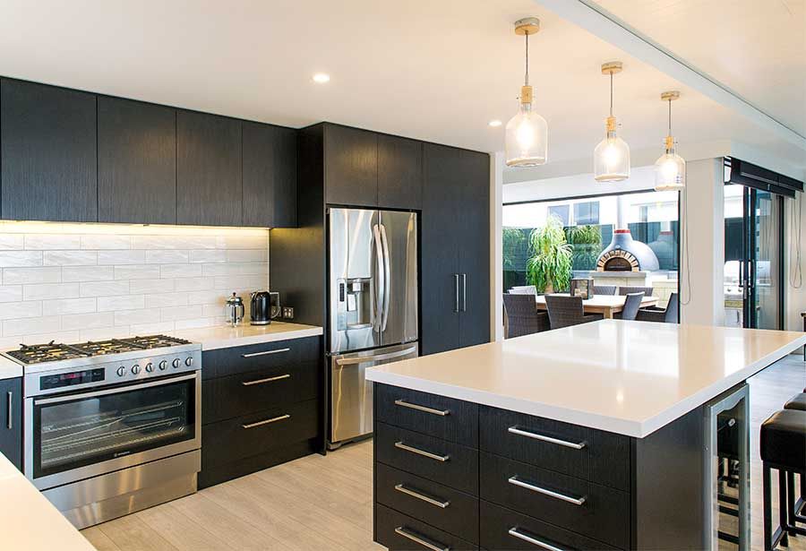 Black kitchen with white stone benchtops